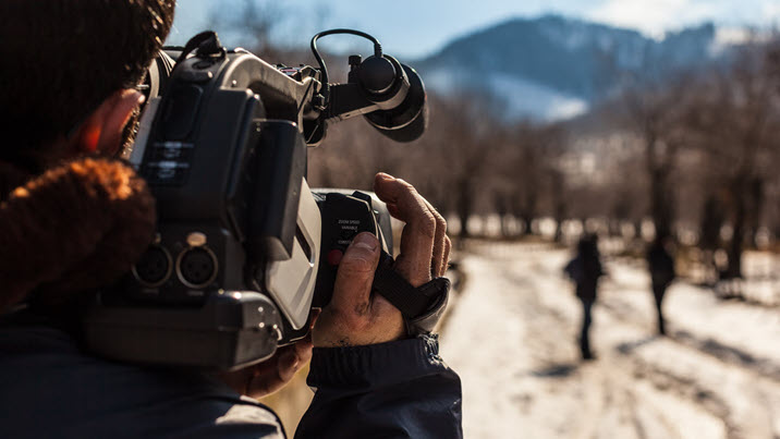 Community TV Camera Man Shooting Content Outside.
