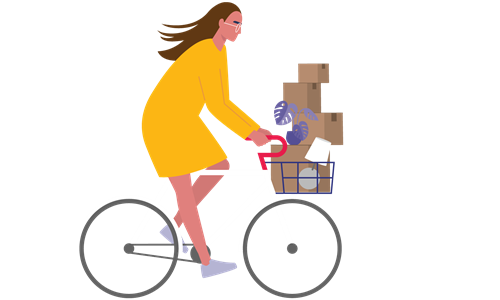Person on a bike with moving boxes in the basket.